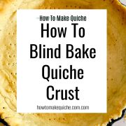 A partially baked, golden pie crust in a pan on a textured surface. Text overlay reads: How to Make Quiche. Learn how to blind bake quiche crust at howtomakequiche.com.